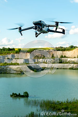 Grodno, Belarus June 11, 2022: A drone DJI MAVIC 3 explores an old abandoned quarry. Aerial photography of an industrial facility Editorial Stock Photo