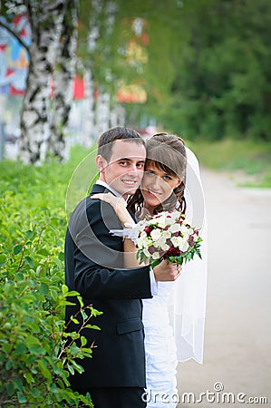 Groom and bride embrace. Love tenderness feeling Stock Photo