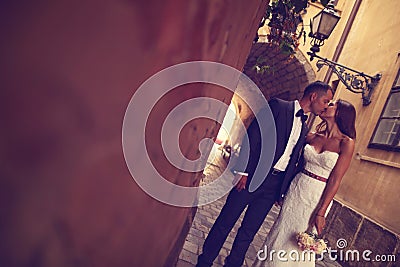 Groom and bride kissing Stock Photo