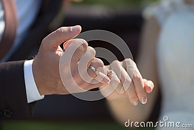 Groom and bride making a pinkie promise Stock Photo
