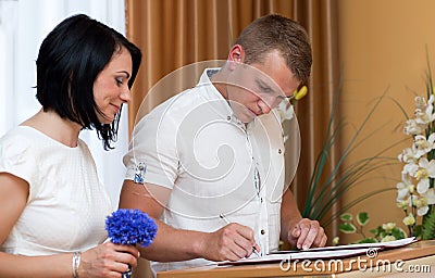 Groom and bride in the registry office get married Stock Photo