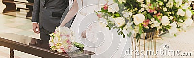 Groom and bride during religious ceremony Stock Photo