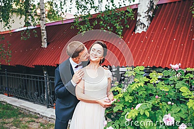 Groom and bride together. couple hugging. Wedding day. Beautiful bride and elegant groom walking after wedding ceremony. Stock Photo