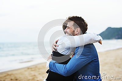 Groom and groomsman at the beach Stock Photo