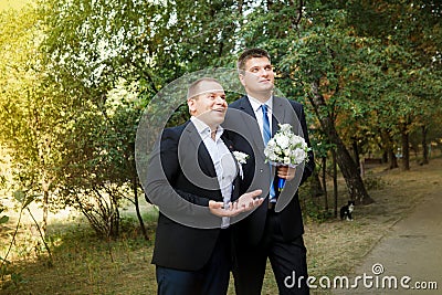 A groom and groomsman came to the bride Stock Photo