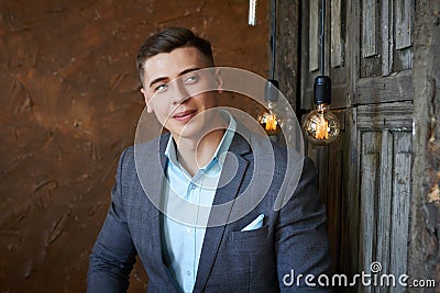 Groom preparing for the wedding. Future husband is waiting for his future wife.A man in a wedding suit poses for the photographer Stock Photo