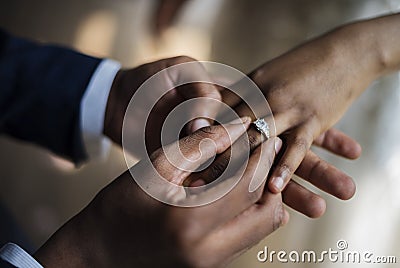 Groom Put on Wedding Ring Bride Hand Stock Photo