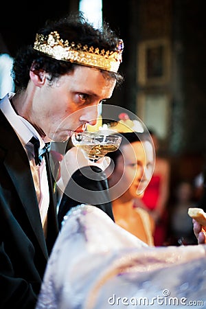 Groom in religious wedding ceremony Stock Photo