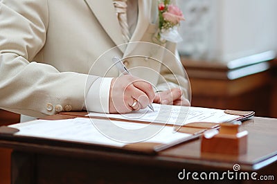 Groom signing marriage license Stock Photo