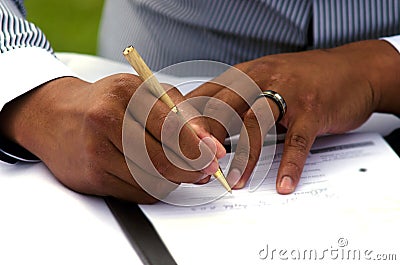 Groom signing marriage license Stock Photo