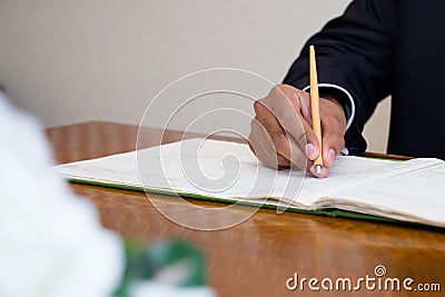 Groom signing Stock Photo