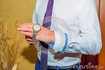 Groom wear watch on hand Stock Photo