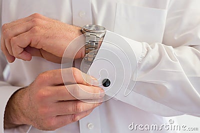 Groom Wearing Cuff Links Stock Photo