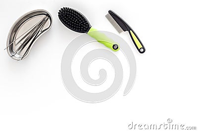 Grooming set with pets cure tools and brushes on white background top view mockup Stock Photo