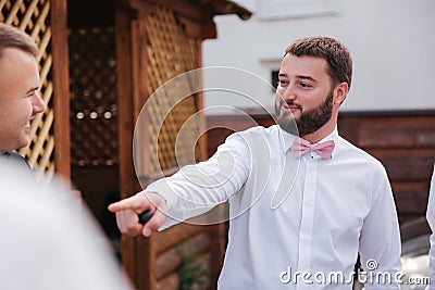 Groomsman spend time with groom at the backyard. Guys laugh and have fun Stock Photo