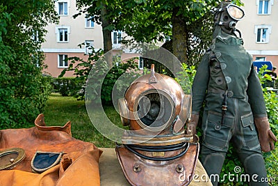 A grotesque diving suit for deep-sea exploration and adventure. Antique diving suit made of metal and leather at the exhibition of Editorial Stock Photo