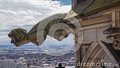 Grotesque gargoyle in gothic minster Stock Photo