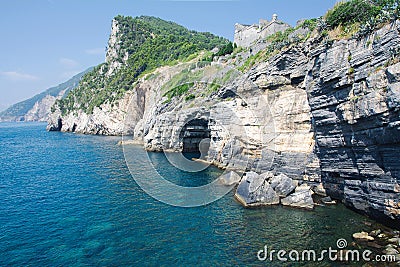 Grotta di lord Byron with turquoise water and coast with rock cliff, Portovenere town, Ligurian sea, park Cinque Terre, La Spezia Stock Photo