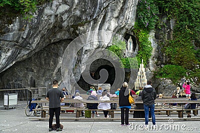 Grotto of Massabielle in the sanctuary of Lourdes, France. Place where the virgin mary appeared to Bernadette Editorial Stock Photo