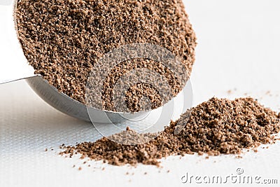 Ground Allspice Spilled from a Teaspoon Stock Photo