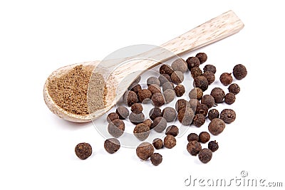 Ground allspice on wooden spoon Stock Photo