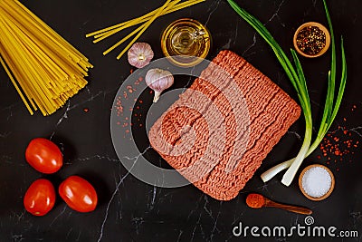 Ground beef, spaghetti pasta, garlic, tomato and green onion Stock Photo