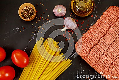 Ground beef, spaghetti pasta, garlic, tomato and olive oil Stock Photo