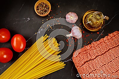 Ground beef, spaghetti pasta, garlic, tomato and olive oil Stock Photo