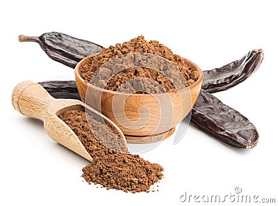 Ground carob and pods on white Stock Photo