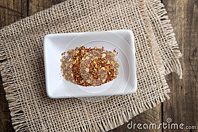 Ground cayenne pepper in bowl Stock Photo