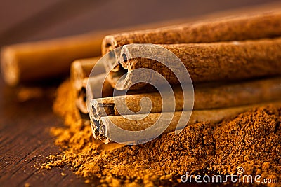 Ground cinnamon and cinnamon sticks Stock Photo