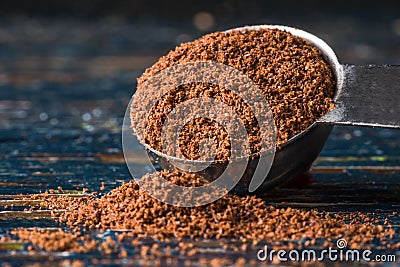 Ground Cloves Spilled from a Teaspoon Stock Photo