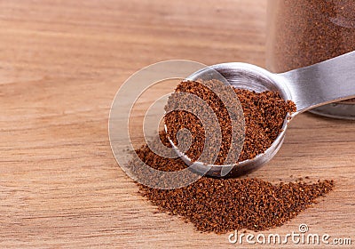 Ground Cloves on a Wooden Table Stock Photo
