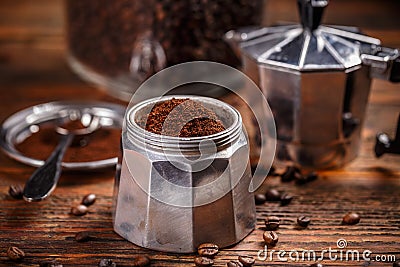 Ground coffee and moka pot Stock Photo