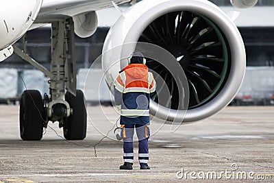 A ground control manager controls start turbofan engine process Stock Photo