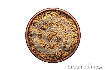 ground nutmeg powder spice in wooden bowl, isolated on white background. Seasoning top view Stock Photo