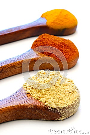 Ground spice on wooden spoons Stock Photo
