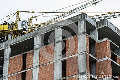 Ground view of a new modern residential house building under construction. Real estate development concept. Multi story home from Editorial Stock Photo
