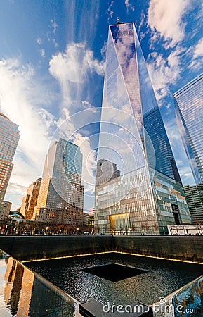 Ground Zero Memorial with One World Trade Center in the background in New York City Editorial Stock Photo