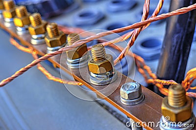 Grounding bus with terminals and wires inside of electrical control cubicle Stock Photo