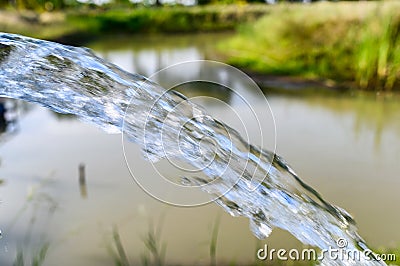 Groundwater gushing in pond Stock Photo