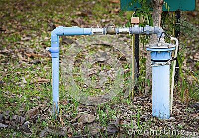 Groundwater well with pvc pipe and system electric deep well submersible pump water Stock Photo