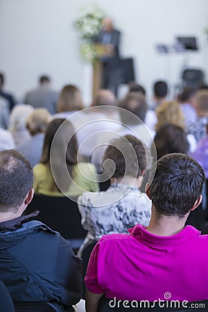 Group of Adult Professionals Listening to the Lecturer Speaking on Stage Editorial Stock Photo