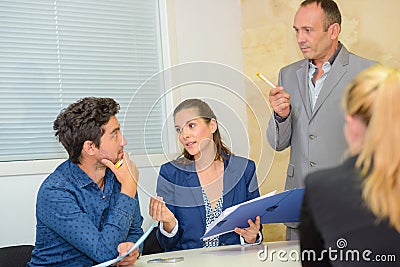 Group adults in discussion in meeting Stock Photo