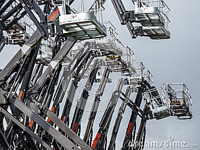 Group of aerial work platforms for construction and material handling. Close-up on the metal lift Editorial Stock Photo