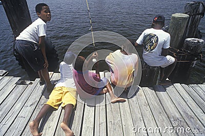 Group of African-American children fishing Editorial Stock Photo