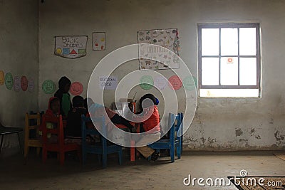 Group of african children studying by a desk in rural Swaziland Editorial Stock Photo