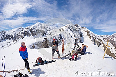 Group of alpinists selfie on mountain top. Scenic high altitude background on snow capped Alps, sunny day. Editorial Stock Photo