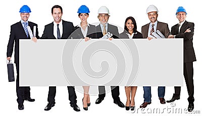 Group of architects presenting empty banner Stock Photo
