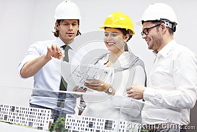 Group of architects sharing their ideas Stock Photo